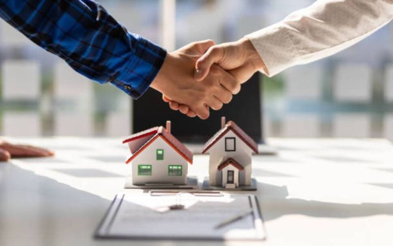 shaking hands at an open house