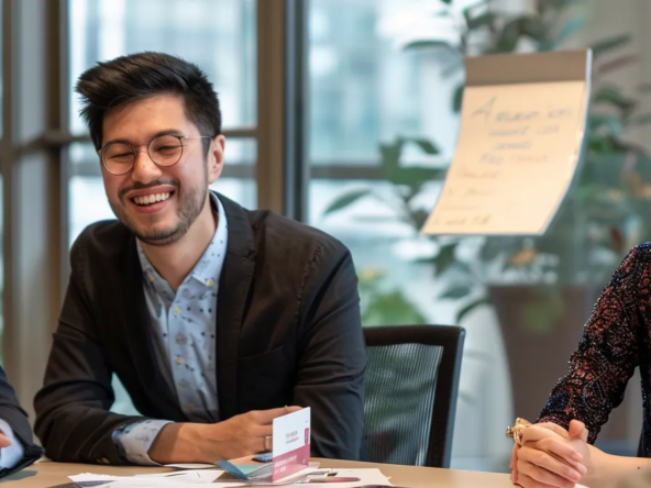 a diverse group of young professionals discussing mortgage eligibility criteria in a modern office boardroom.