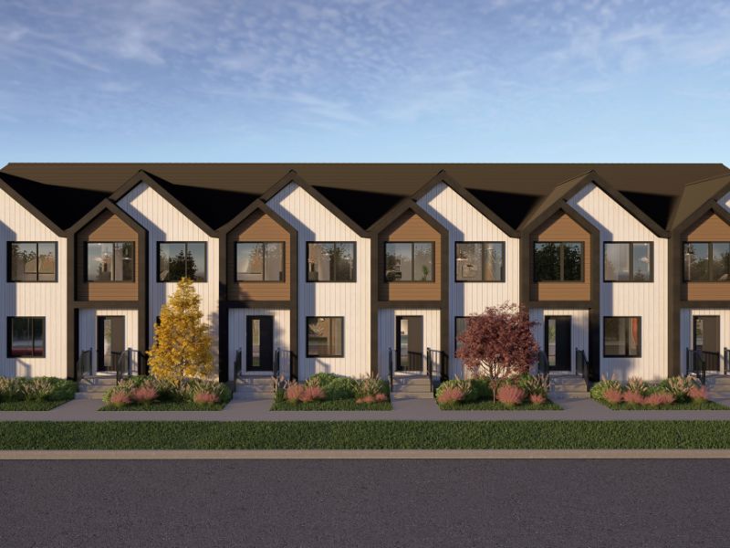 Modern Riversedge townhouses with white siding and wood accents, showcasing an MLI Select multi-unit development.